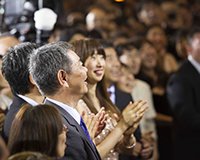 Attendees at Tokyo Ideal Org opening ceremony applaud speaker